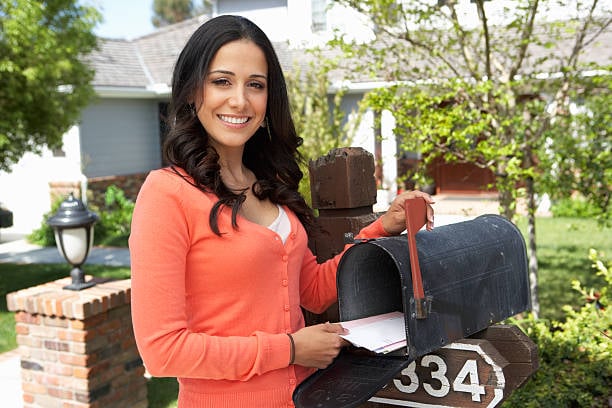 girl opening mailbox new one